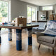 Carefully wrapped dining table and accent chair prepared for long-distance moving